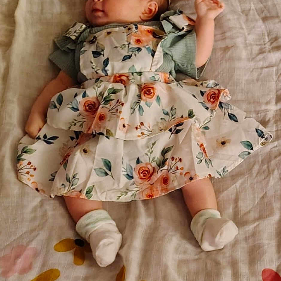 Alexia joined the competition — help win amazing prizes! baby, blanket, clothing, cushion, dress, face, hat, head, homedecor, hosiery, newborn, person, photography, portrait, quilt, sitting, sleeping, sleeve, sock, yawning