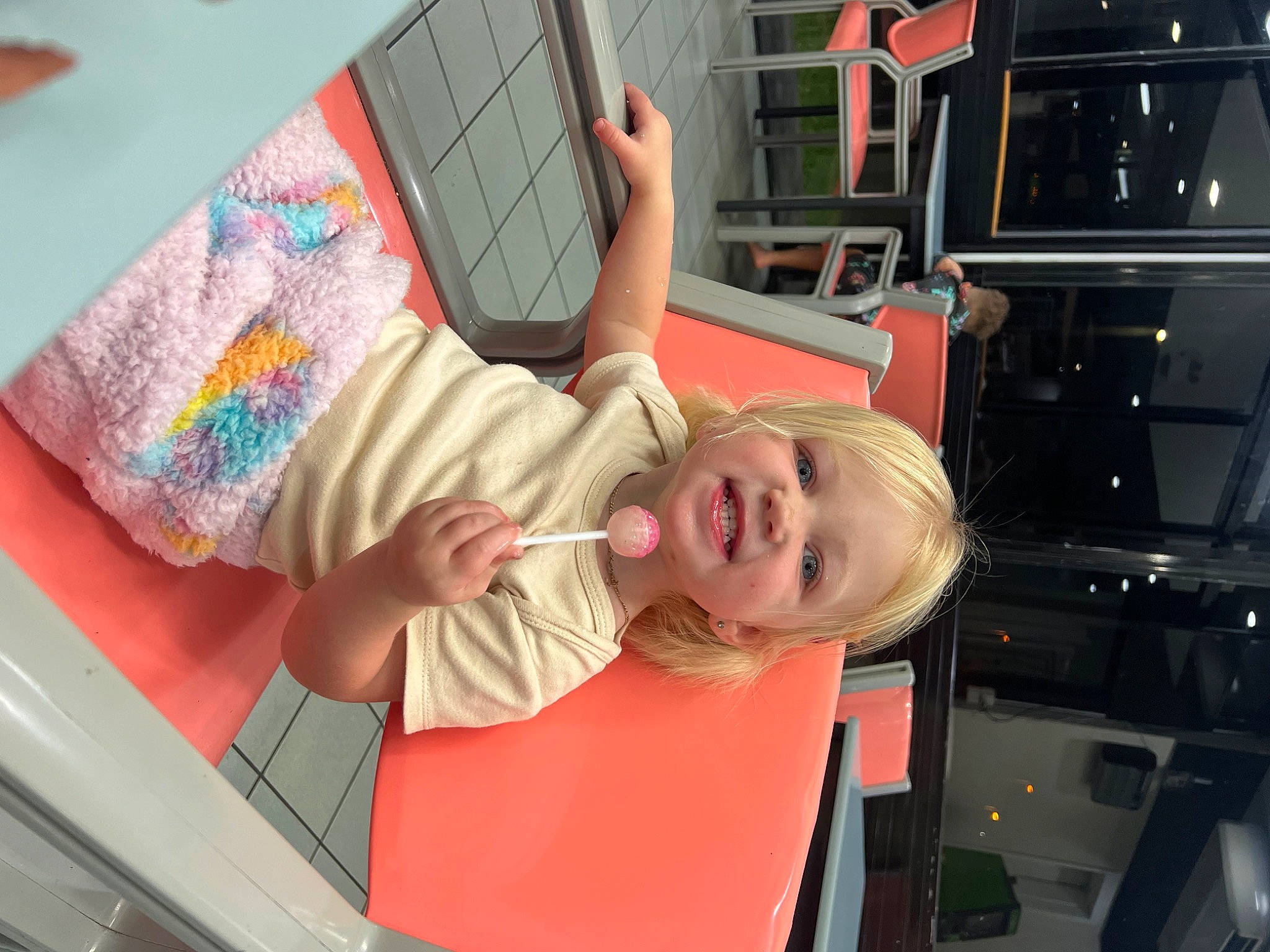 Avaleigh is registered to the contest to win money with this photo: art, automotive_design, automotive_exterior, child, computer, finger, fun, joy, laptop, leisure, motor_vehicle, pattern, person, personal_computer, play, room, smile, t_shirt, tire, toddler