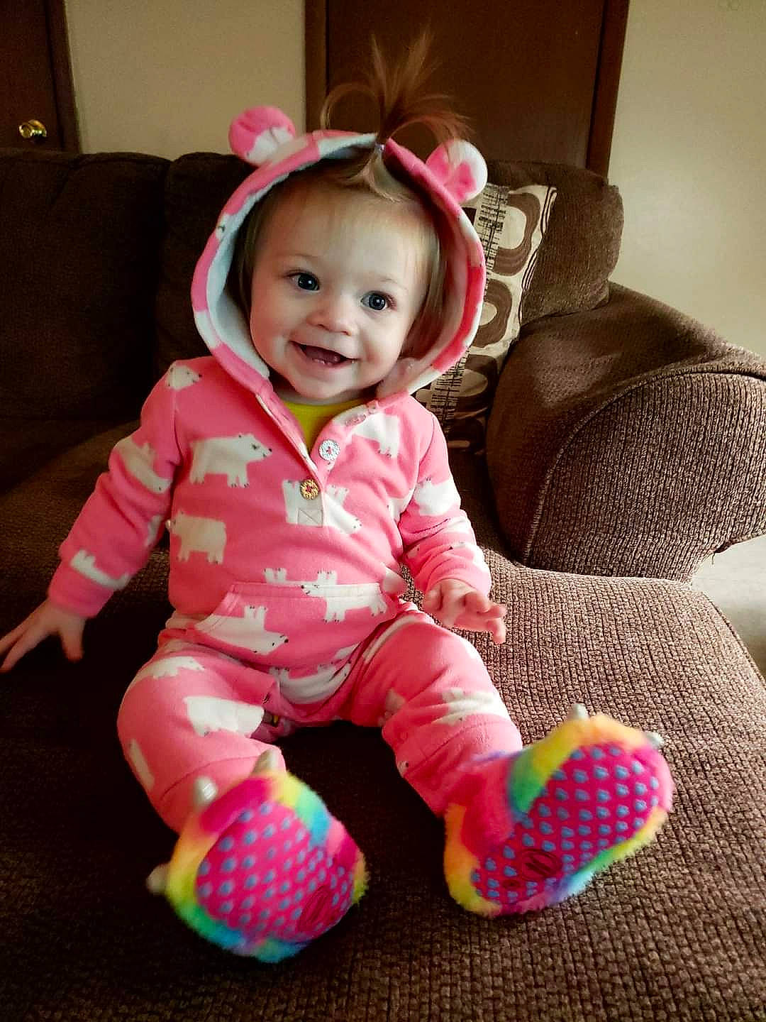 Ireland is registered to the contest to win money with this photo: baby, baby_toddler_clothing, cheek, comfort, eye, face, hairstyle, happy, head, human_body, iris, joy, outerwear, person, pink, product, purple, skin, sleeve, smile