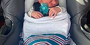 Colton joined the competition — help win amazing prizes! baby, blanket, car_seat, child, cozy, cute, head_support, indoors, infant, newborn, pacifier, peaceful, resting, safety, seatbelt, sleeping, small_hands, striped_blanket, warning_label, wrapped