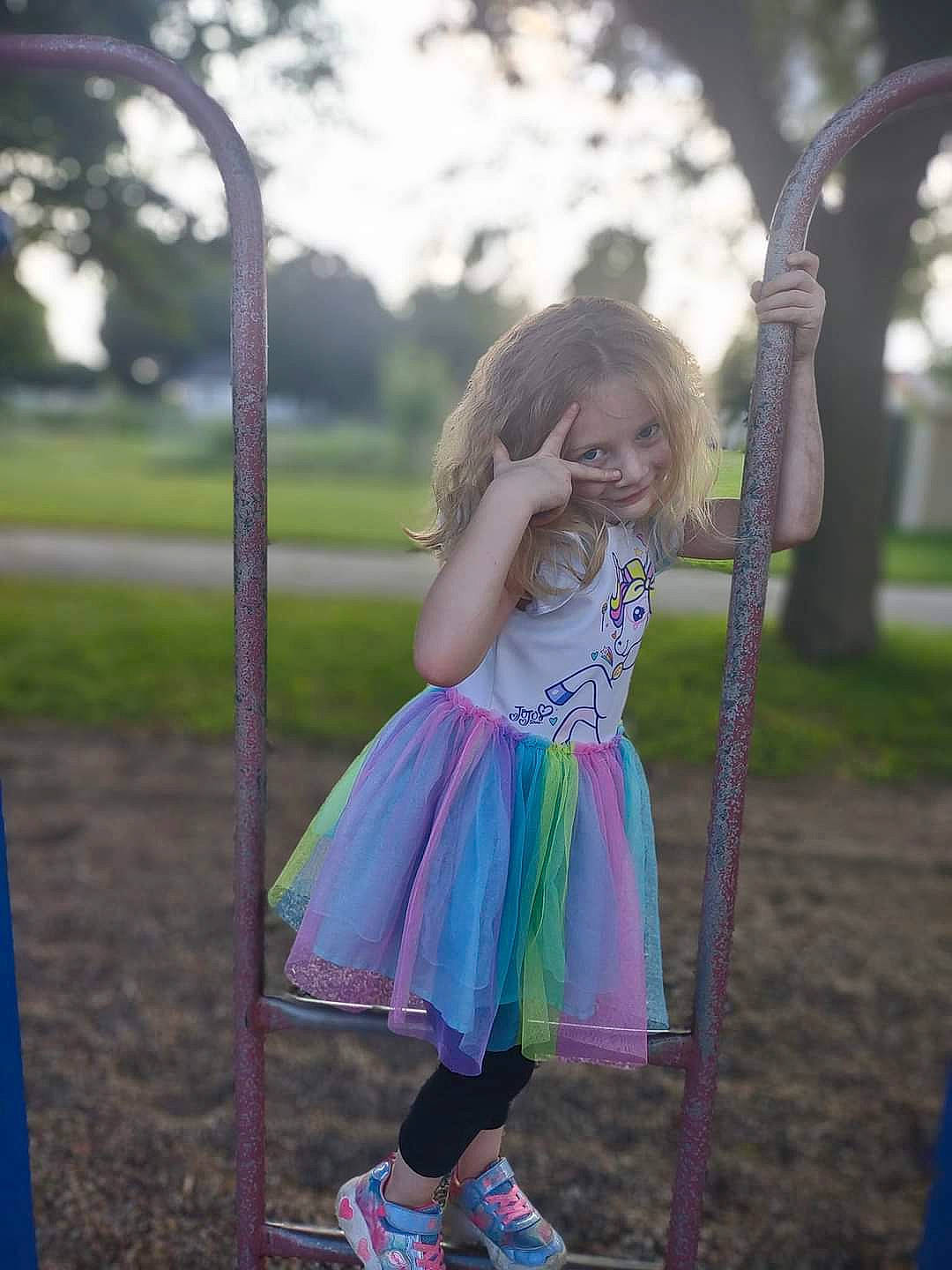 Gracey is registered to the contest to win money with this photo: child, city, fun, grass, happy, leisure, magenta, outdoor_play_equipment, people, person, pink, plant, playground, pole, purple, recreation, sandal, sky, spring, toddler