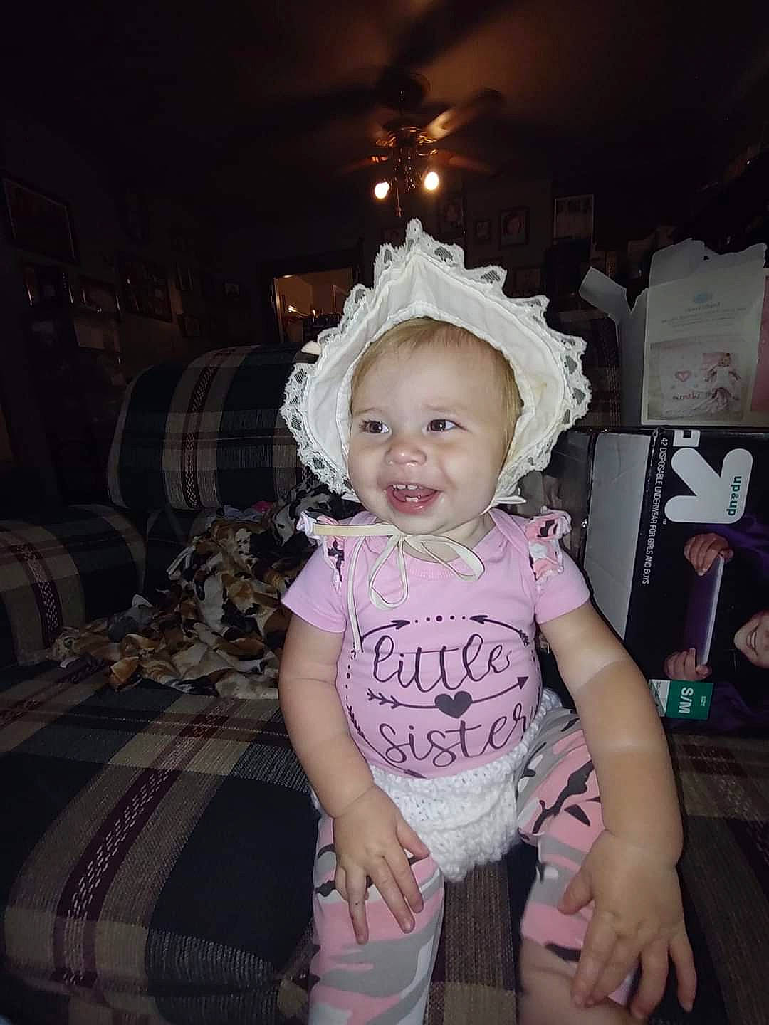 Rosey is registered to the contest to win money with this photo: baby, baby_products, baby_toddler_clothing, chair, child, couch, darkness, event, fashion_accessory, flash_photography, fun, happy, headband, iris, magenta, person, purple, room, sitting, smile