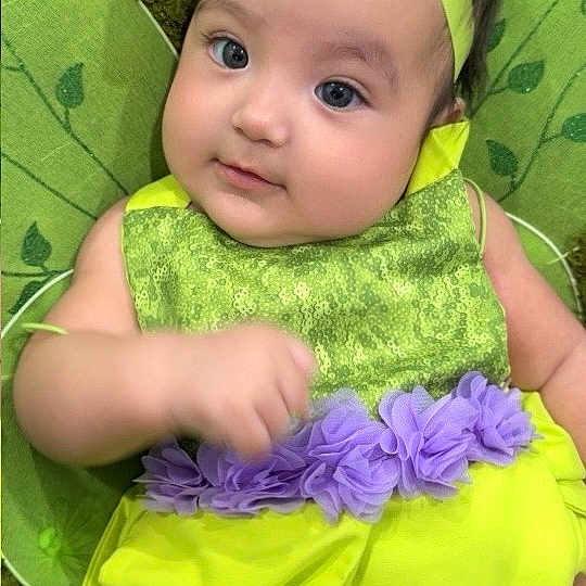 Jesiah Cataleya is registered to the contest to win money with this photo: baby, child, green_dress, headband, bow, infant, cute, portrait, smiling, sitting, person, face, young_child, indoors, colorful, clothing, happy, closeup, baby_girl, soft_texture