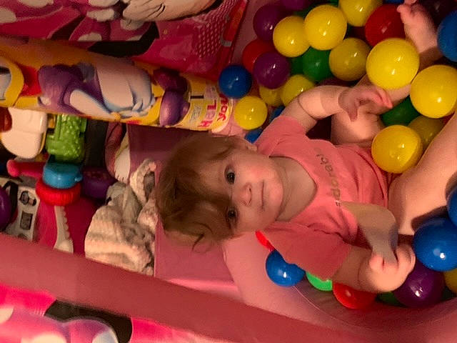Fiona is registered to the contest to win money with this photo: baby, baby_toys, ball_pit, child, fun, leisure, person, play, product, toddler, toy