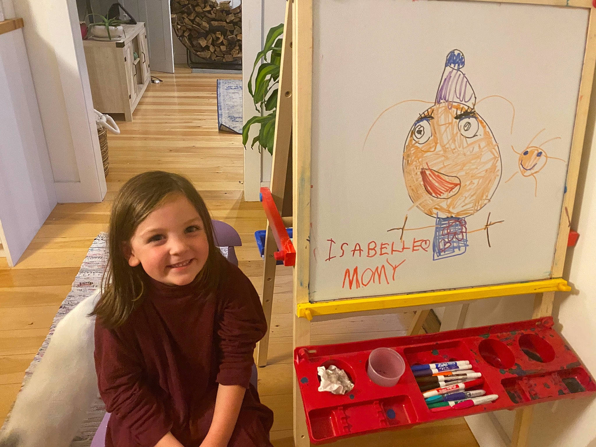 Isabelle is registered to the contest to win money with this photo: art, child, drawing, easel, illustration, joy, person, room, visual_arts
