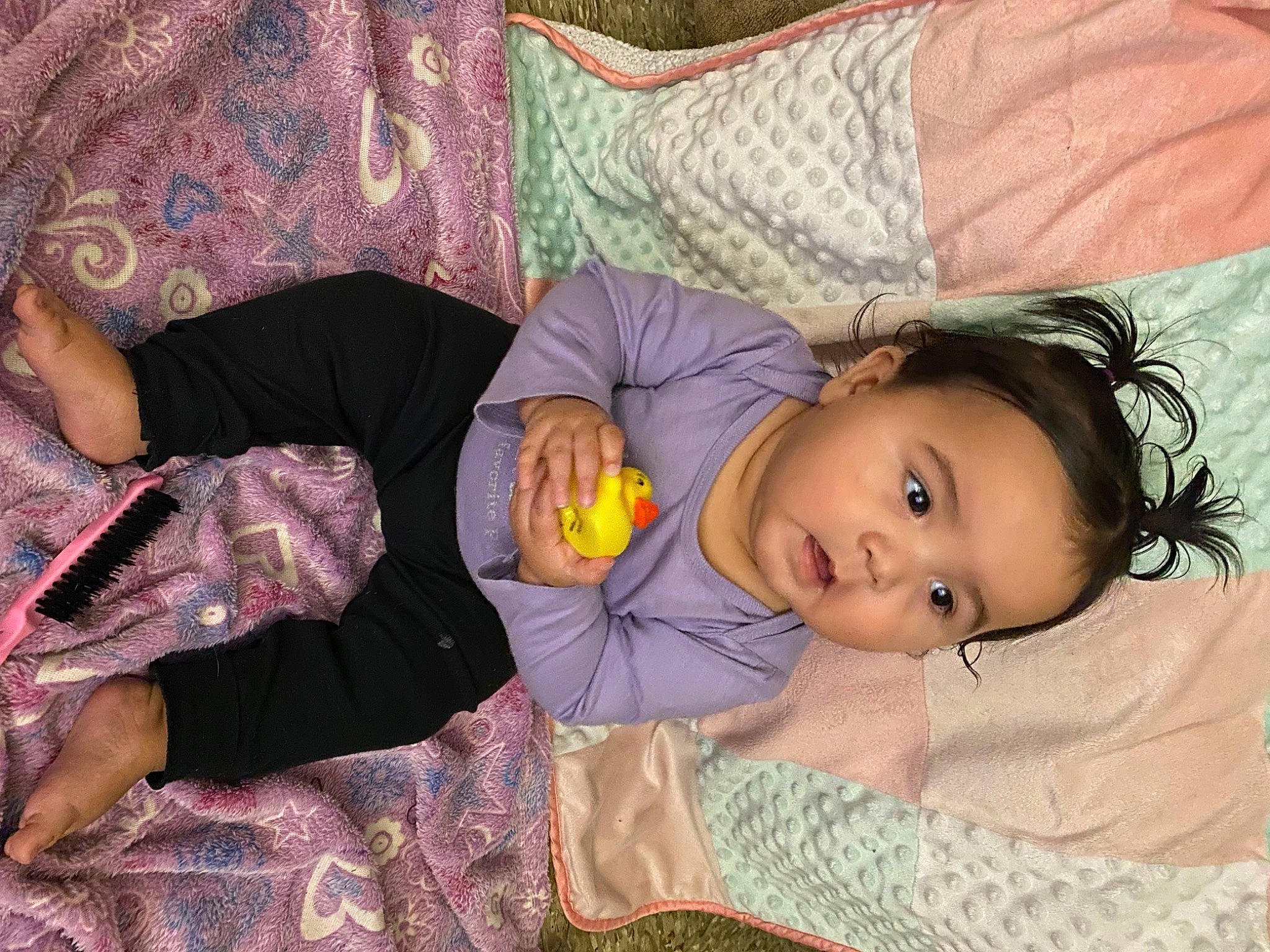 Imaani is registered to the contest to win money with this photo: baby, baby_toddler_clothing, bedtime, cheek, child, comfort, couch, fun, grass, lap, linens, nap, pattern, person, purple, room, sitting, skin, toddler, tree