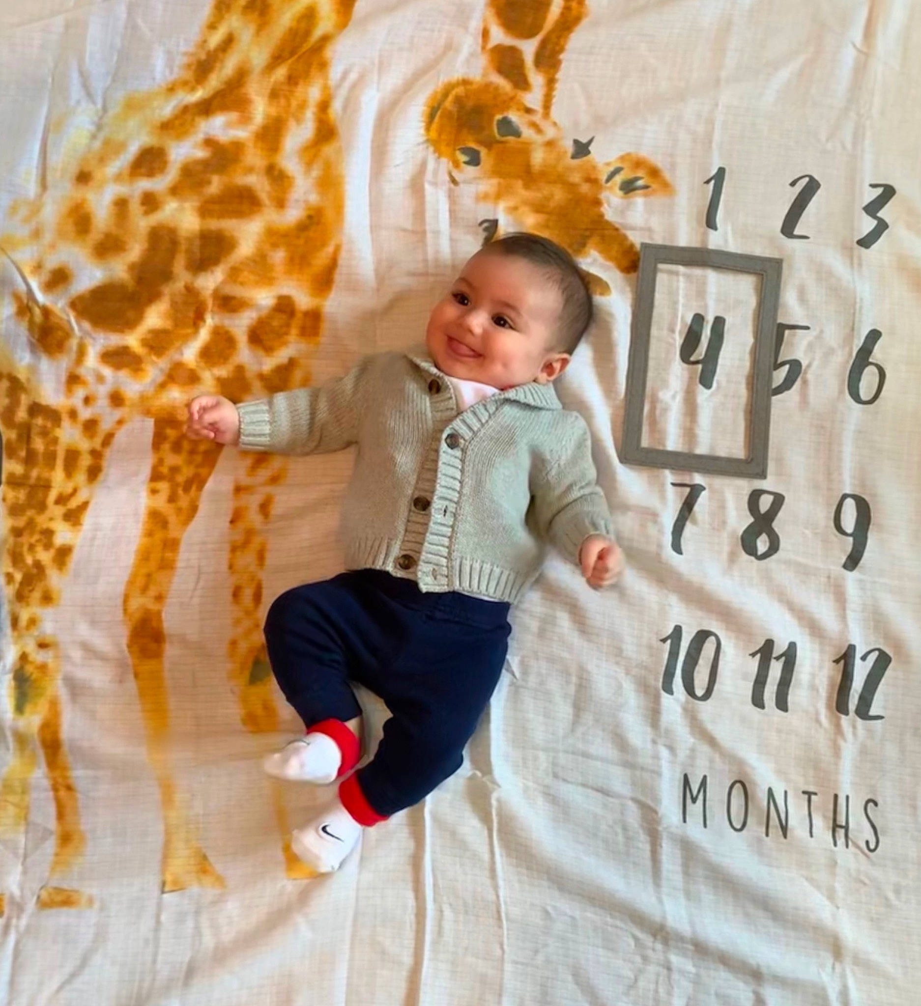 Camden joined the competition — help win amazing prizes! baby, child, fawn, giraffe, giraffidae, happy, joy, pattern, person, photography, textile, toddler, yellow