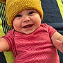 baby, beanie, bodypart, bonnet, cap, clothing, face, finger, glove, hand, happy, hat, head, laughing, newborn, pants, person, photography, portrait, smile