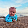 baby, child, beach, sand, ocean, water, sky, swimsuit, blue, turtle, infant, portrait, outdoor, sunlight, cute, young, lying_down, nature, waves, shore
