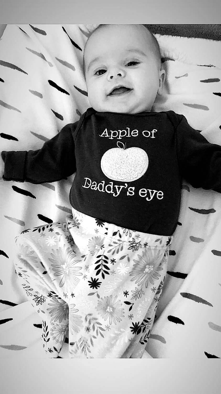 Cassidy is registered to the contest to win money with this photo: baby_toddler_clothing, black, black_and_white, cool, eye, hairstyle, happy, head, human, monochrome, organ, person, photograph, product, sleeve, smile, standing, style, t_shirt, toddler