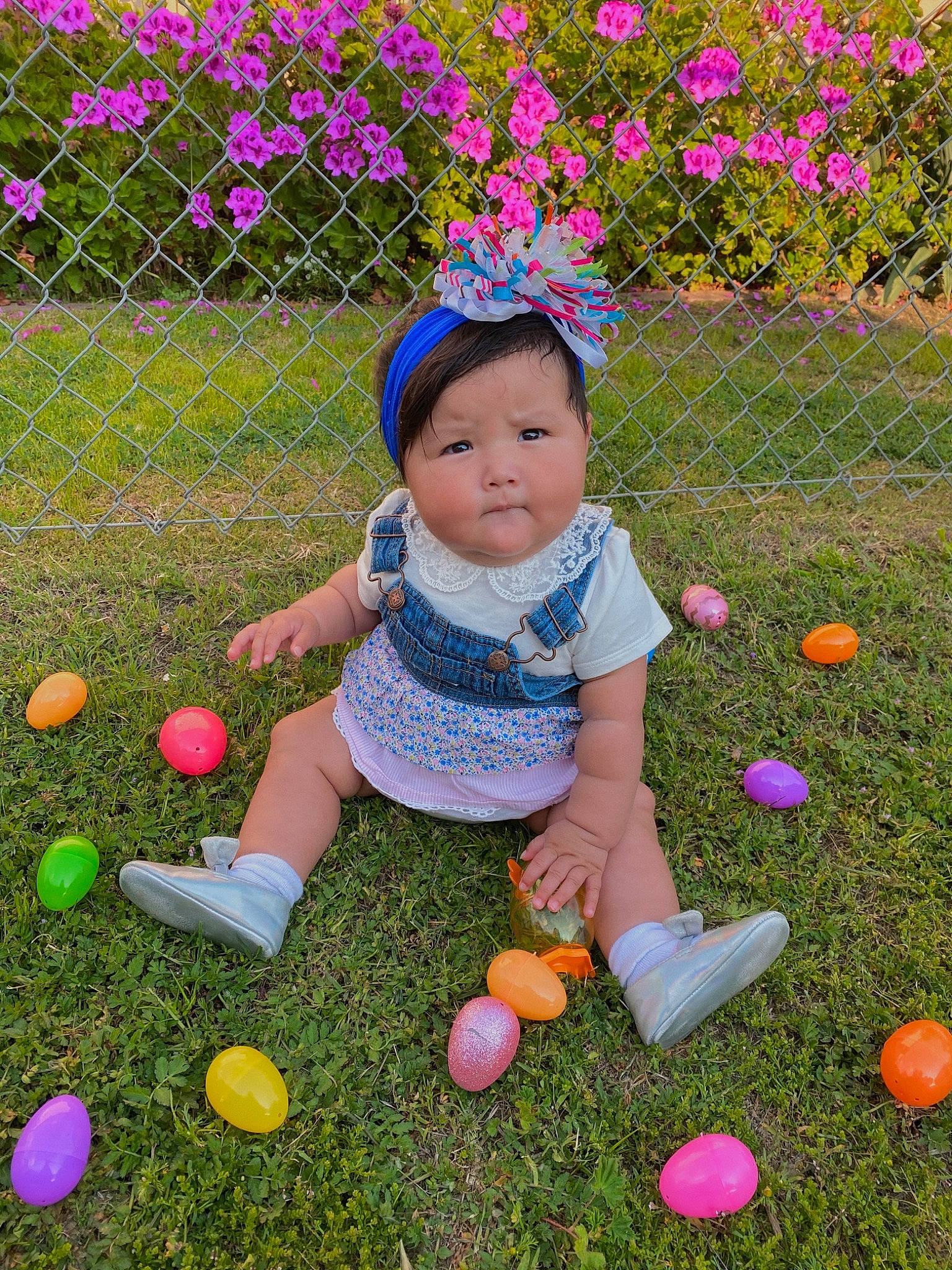 Celine is registered to the contest to win money with this photo: ball, child, easter, easter_egg, flower, grass, holiday, person, pink, plant, play, spring, toddler