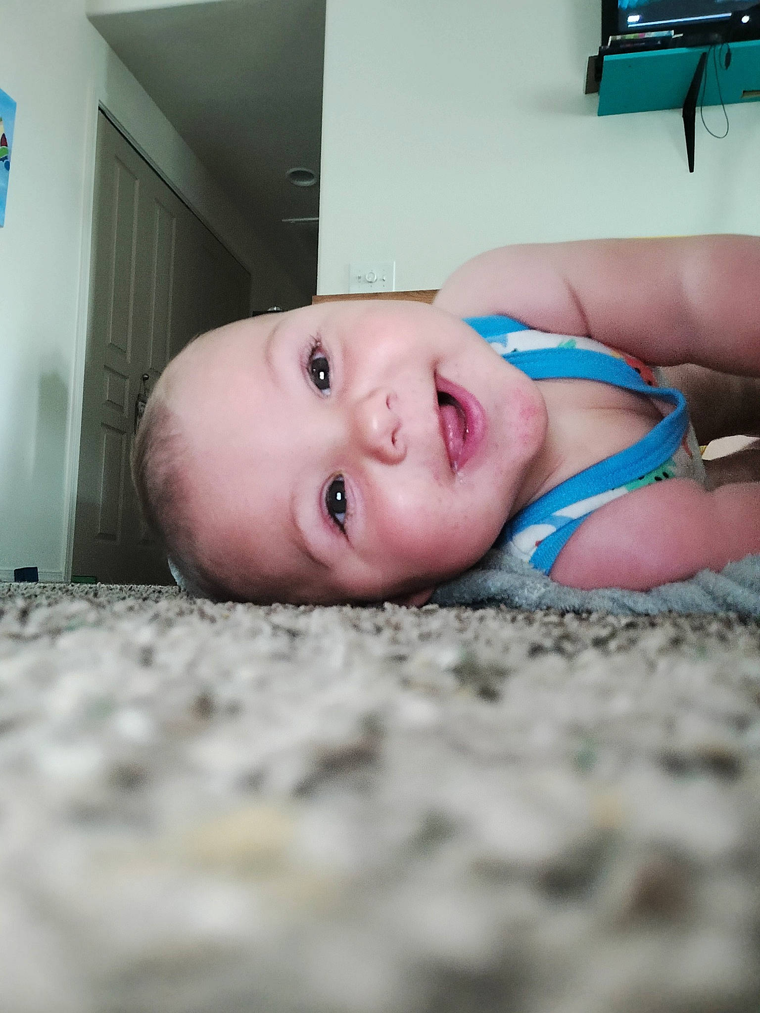 Rayray is registered to the contest to win money with this photo: abdomen, baby, baby_toddler_clothing, chest, child, comfort, eyebrow, flash_photography, flooring, fun, hand, human_body, human_leg, linens, mouth, person, sitting, skin, thigh, toddler