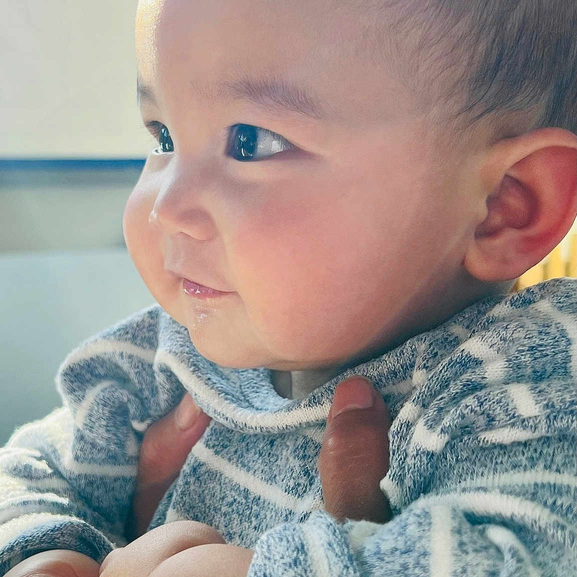 Drayton joined the competition — help win amazing prizes! baby, cheeks, child, closeup, cute, expression, eyes, face, hand, holding, human, indoors, infant, person, portrait, skin, soft_light, striped_clothing, sweater, warm_light