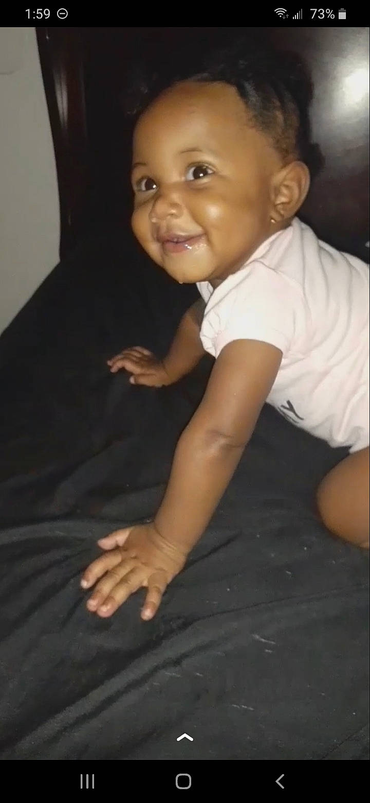 Kataye is registered to the contest to win money with this photo: baby, baby_toddler_clothing, black, cheek, child, chin, comfort, elbow, eyebrow, flash_photography, fun, gesture, iris, joy, lip, person, sitting, skin, sleeve, smile