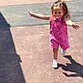 toddler, child, running, pink_romper, pacifier, shadow, sunlight, outdoor, concrete, legs, shoes, happy, playful, daytime, people, casual_clothing, expression, movement, small_child, summer