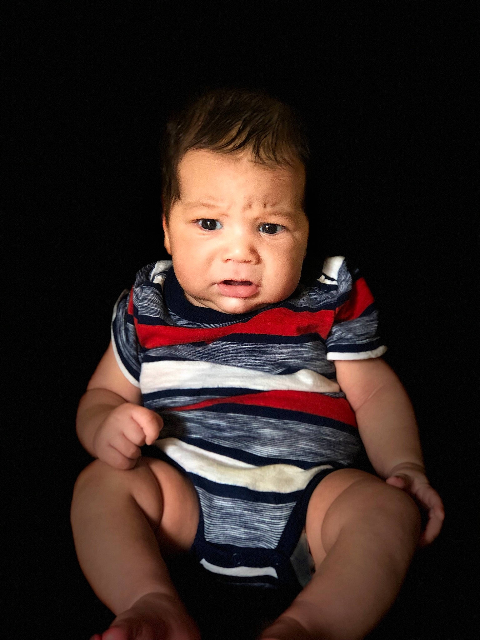 Hayven is registered to the contest to win money with this photo: arm, baby, cheek, child, chin, face, finger, flash_photography, hand, head, lip, nose, person, photography, portrait_photography, product, sitting, skin, smile, toddler