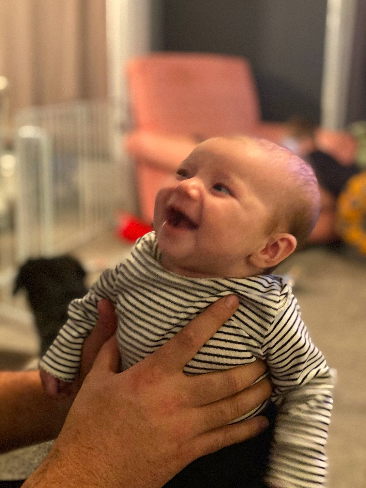 Sutton is registered to the contest to win money with this photo: arm, baby, baby_products, baby_toddler_clothing, cheek, child, comfort, ear, finger, gesture, hand, human, laugh, nail, person, product, skin, thumb, toddler, wrist