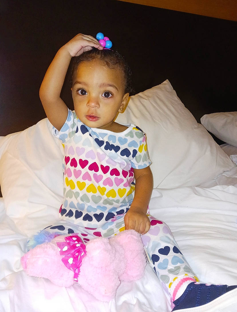 Cassidy is registered to the contest to win money with this photo: baby_toddler_clothing, child, comfort, day_dress, dress, embellishment, fashion_accessory, flash_photography, fun, happy, iris, magenta, one_piece_garment, pattern, person, pink, sitting, skin, sleeve, textile