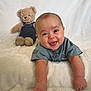 Callahan joined the competition — help win amazing prizes! baby, smiling, teddy_bear, soft_blanket, lying_down, cute, child, plush_toy, happy, portrait, infant, clothing, denim, background, indoor, furniture, toy, person, cute_expression, relaxing