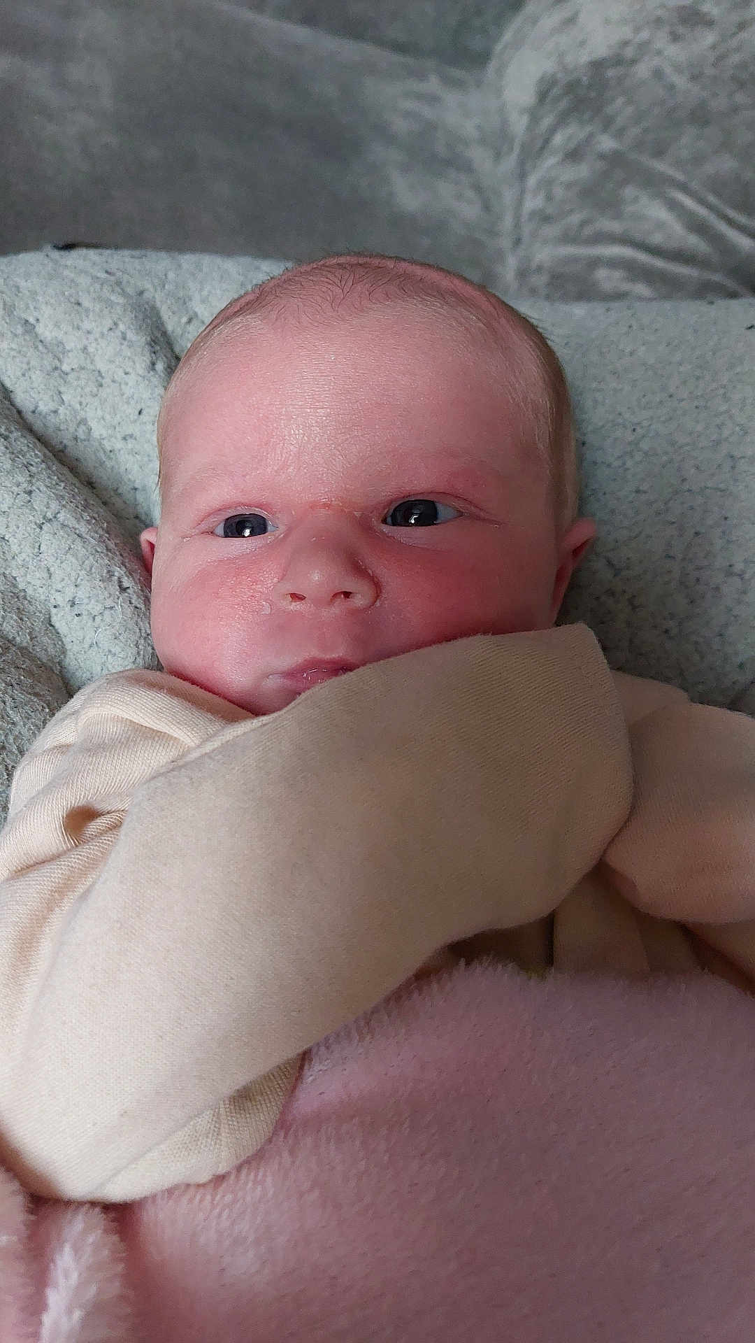 Bonnie-Lynne is registered to the contest to win money with this photo: baby, beige_clothing, blanket, close_up, cozy, cute, expression, eyes, face, head, indoors, infant, newborn, newborn_baby, pink_blanket, portrait, resting, skin, soft_texture, young_child