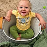 baby, blanket, bucket, carpet, child, cozy, cute, face, foot, green_pants, hand, happy, home, indoor, portrait, sitting, smiling, toddler, toy, yellow_shirt