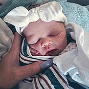 Brooklyn joined the competition — help win amazing prizes! newborn, baby, sleeping, headband, bow, hand, nail_polish, blanket, striped_blanket, cozy, soft_lighting, close_up, portrait, infant, cute, peaceful, wrapped, tender, human, skin