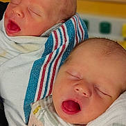 Madisyn Maddox Twins is registered to the contest to win money with this photo: newborn, baby, sleeping, blanket, wrapped, infant, cute, peaceful, soft, closeup, face, mouth_open, hospital, swaddled, newborn_baby, child, twin, indoor, portrait, human