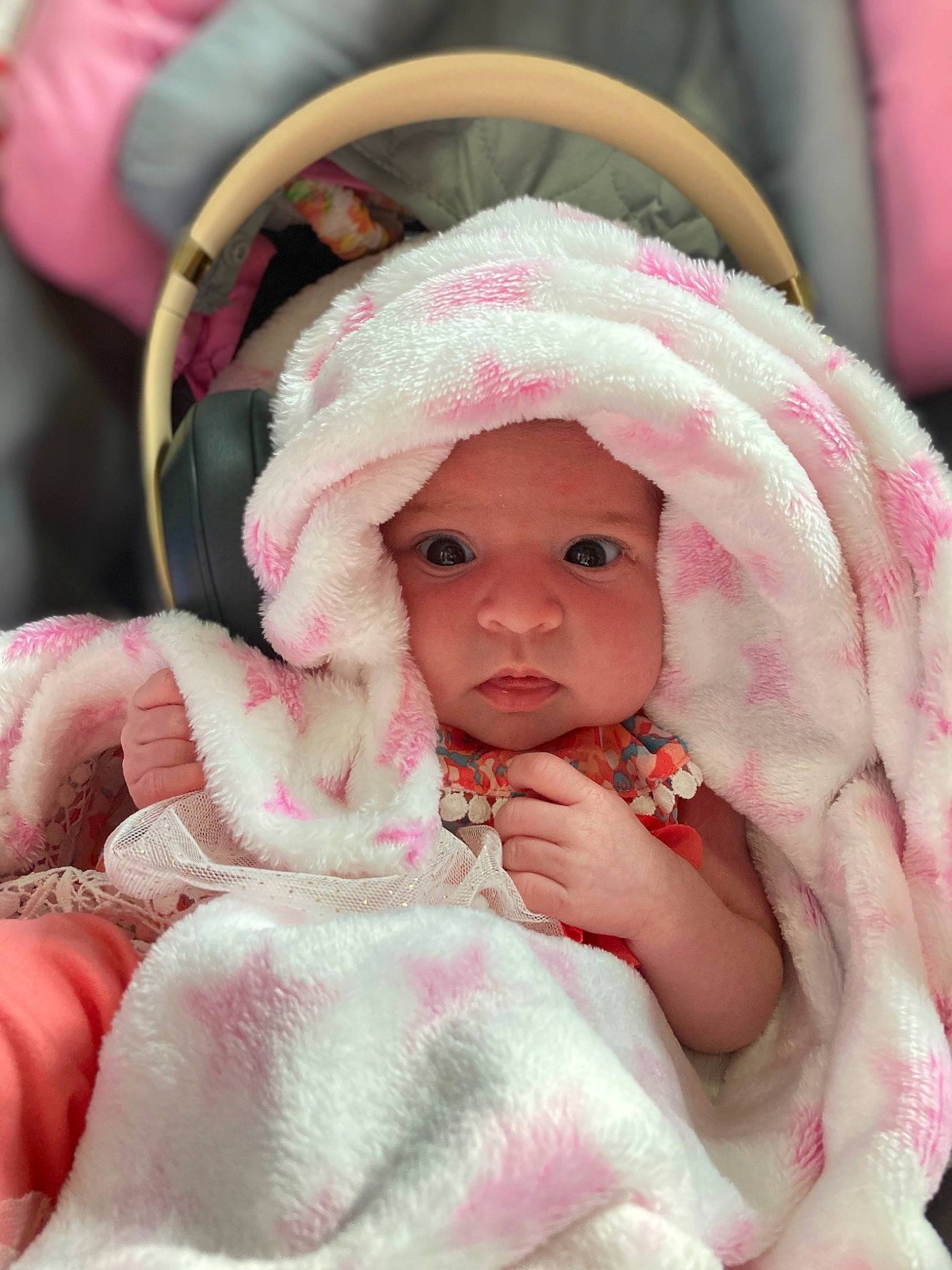 Esmeé is registered to the contest to win money with this photo: baby, baby_toddler_clothing, cap, cheek, comfort, dress, eye, eyelash, head, headwear, iris, linens, lip, magenta, nose, person, pink, skin, sleeve, textile