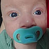 Owen joined the competition — help win amazing prizes! baby, close_up, face, blue_eyes, pacifier, infant, child, skin, green_clothing, mouth, nose, eyelashes, portrait, human, cute, young, head, expression, indoor, soft_light