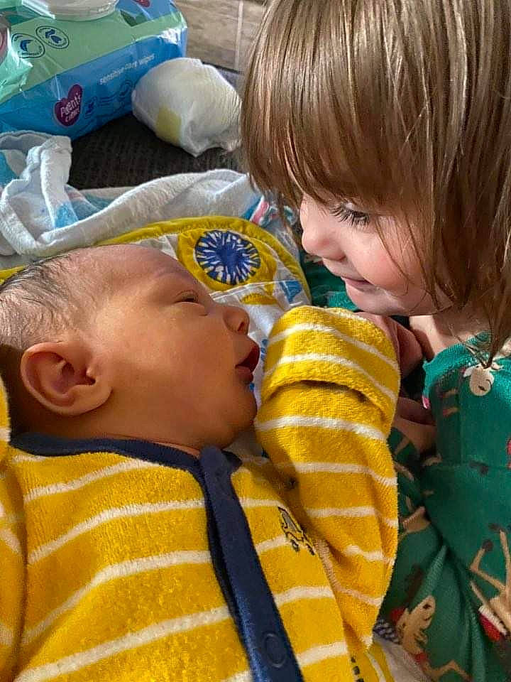 Milena joined the competition — help win amazing prizes! baby, baby_products, baby_toddler_clothing, baby_toys, bangs, blond, cheek, child, interaction, person, plastic, plastic_bag, toddler, toy, yellow