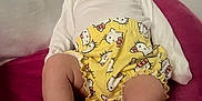 Annabella joined the competition — help win amazing prizes! apparel, baby, blanket, child, clothing, cute, expression, face, feet, headband, hello_kitty, indoors, infant, legs, person, pink, shorts, sitting, soft_fabric, yellow
