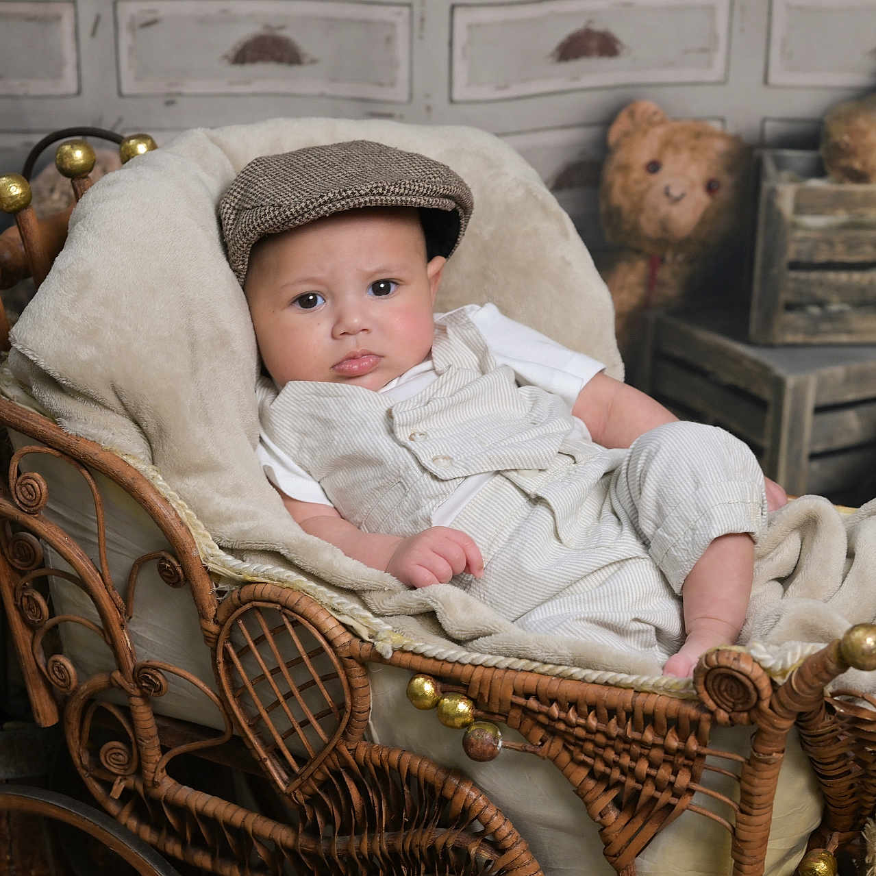 Yohannes is registered to the contest to win money with this photo: baby, blanket, carriage, child, childhood, clothing, cozy, cute, decor, expression, furniture, hat, indoors, plush, portrait, resting, soft, teddy_bear, vintage, wicker