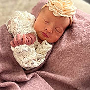 Maëlya participe au concours pour gagner de l'argent avec cette photo : newborn, baby, sleeping, lace, headband, flower, blanket, soft_texture, peaceful, portrait, infant, cute, closeup, wrapped, delicate, hands, face, cozy, resting, indoors