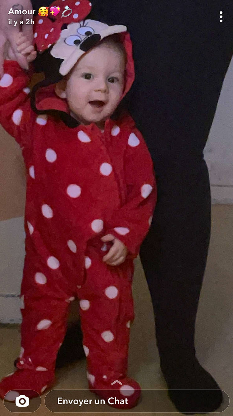 Marie participe au concours pour gagner de l'argent avec cette photo : active_pants, baby, baby_products, baby_toddler_clothing, cap, cheek, child, collar, eye, face, head, magenta, outerwear, pajamas, pattern, person, pink, skin, sleeve, smile