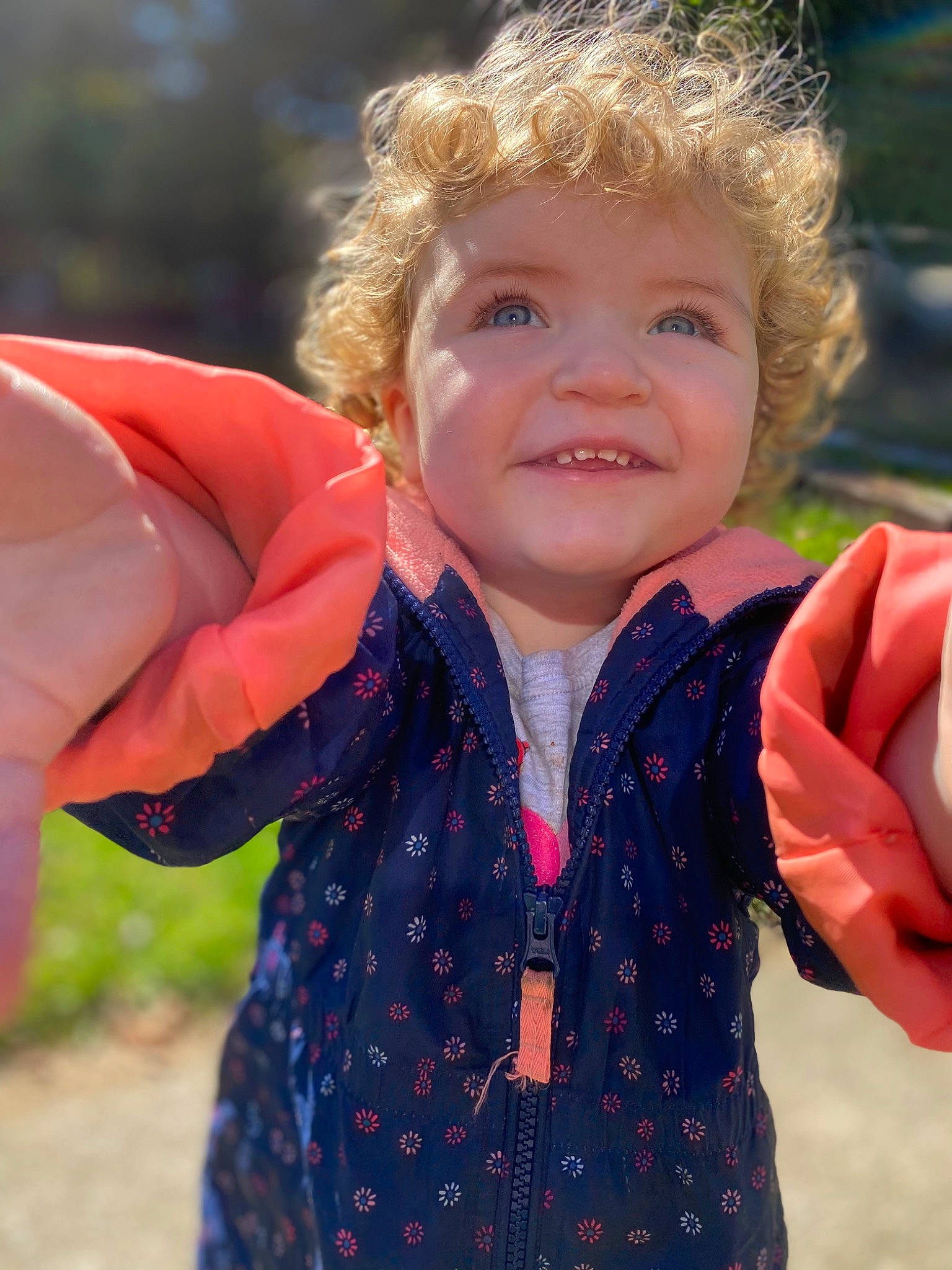 Guinevere joined the competition — help win amazing prizes! baby_toddler_clothing, eye, face, finger, gesture, grass, hair, happy, human_body, iris, joy, leaf, lip, neck, nose, outerwear, people_in_nature, person, skin, sleeve