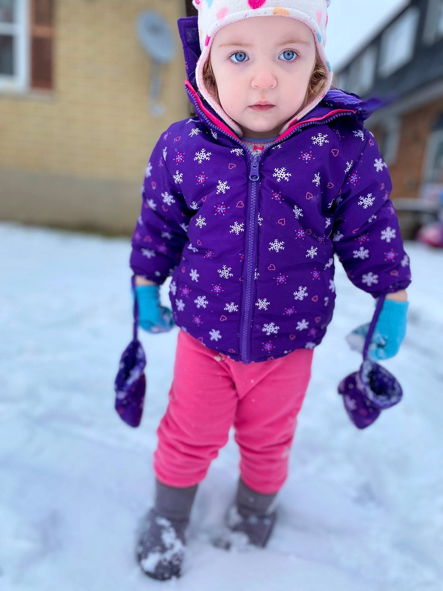 Guinevere is registered to the contest to win money with this photo: baby, baby_toddler_clothing, child, electric_blue, footwear, freezing, fun, headwear, magenta, outerwear, pattern, person, pink, purple, recreation, sleeve, snow, toddler, violet, white