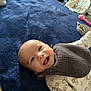 Makaio joined the competition — help win amazing prizes! baby, baby_bouncer, bib, blanket, child, clothing, cozy, cute, face, happy, indoor, infant, lying_down, onesie, person, playful, room, smiling, soft_texture, toy