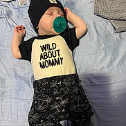 Makaio joined the competition — help win amazing prizes! baby, sleeping, pacifier, hat, black_and_white_clothing, blue_sheet, blanket, infant, cute, peaceful, child, lying_down, soft_fabric, patterned_pants, toddler, bedroom, resting, young_child, clothing, indoor
