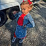 Romy a rejoint le concours — aidez-le/la à gagner de superbes lots ! child, girl, denim_jacket, denim_skirt, red_top, red_bows, pigtails, gravel, outdoor, sneakers, shadow, vehicle, tire, sunlight, posing, fashion, confident, casual, cute, playful