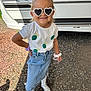 Romy participe au concours pour gagner de l'argent avec cette photo : child, girl, sunglasses, heart_shaped, tshirt, denim_skirt, sandals, outdoor, gravel, smiling, posing, bracelets, sunny, daylight, camper, fashion, accessories, happy, young, casual