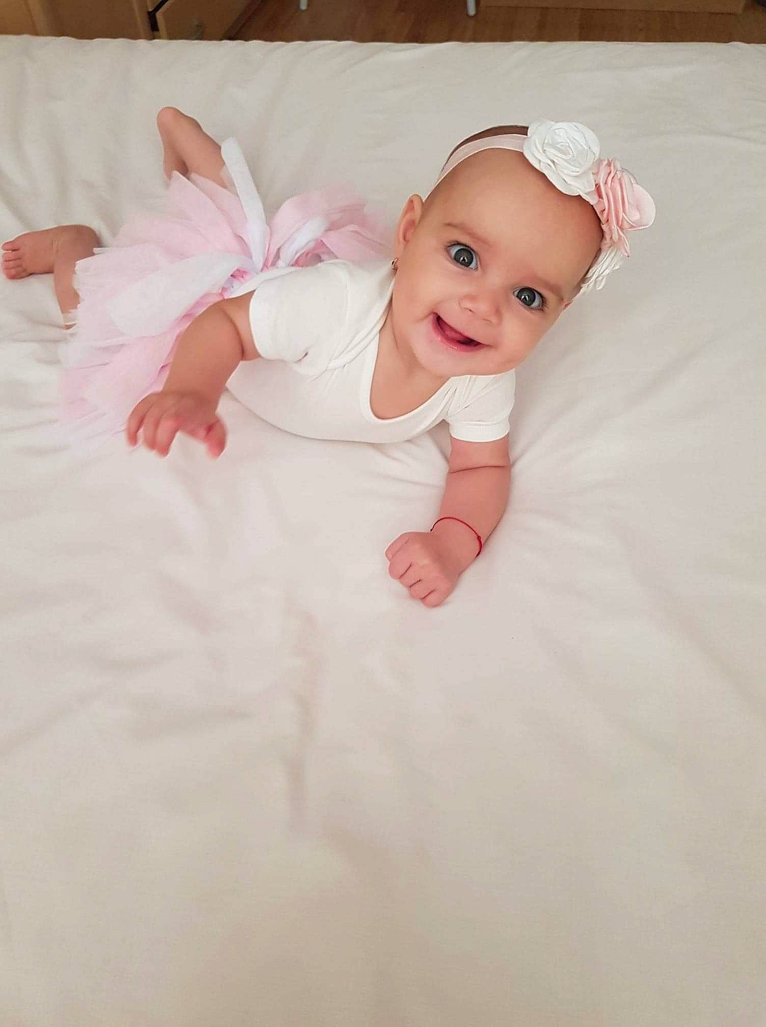 Medeea joined the competition — help win amazing prizes! baby, baby_products, baby_toddler_clothing, bedding, cheek, child, costume, eye, face, hair_accessory, head, headwear, joy, linens, person, photography, pink, product, skin, textile