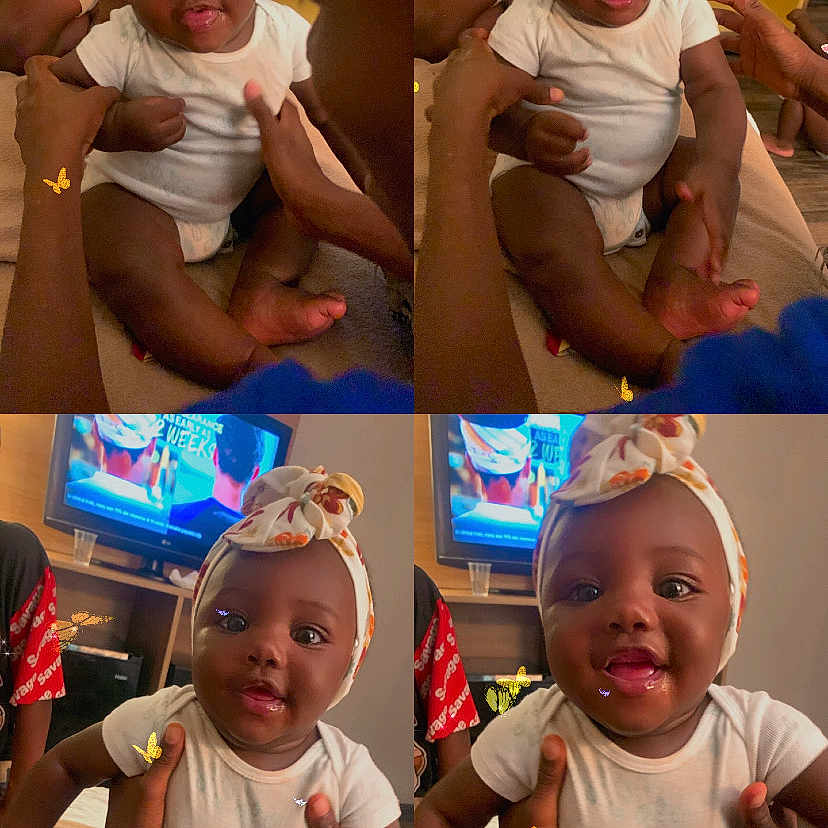 Sahvasia is registered to the contest to win money with this photo: adult_hands, baby, butterflies, candid, child, cute, family, floor, furniture, happy, headband, holding, indoor, infant, living_room, person, playful, smiling, television, white_clothing