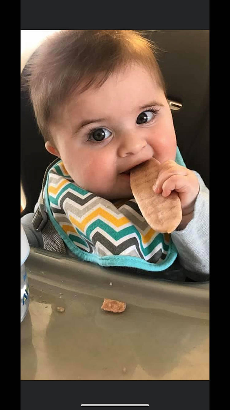 Ryder is registered to the contest to win money with this photo: baby, baby_food, cheek, child, chin, eating, eye, face, finger, head, junk_food, mouth, nose, person, toddler