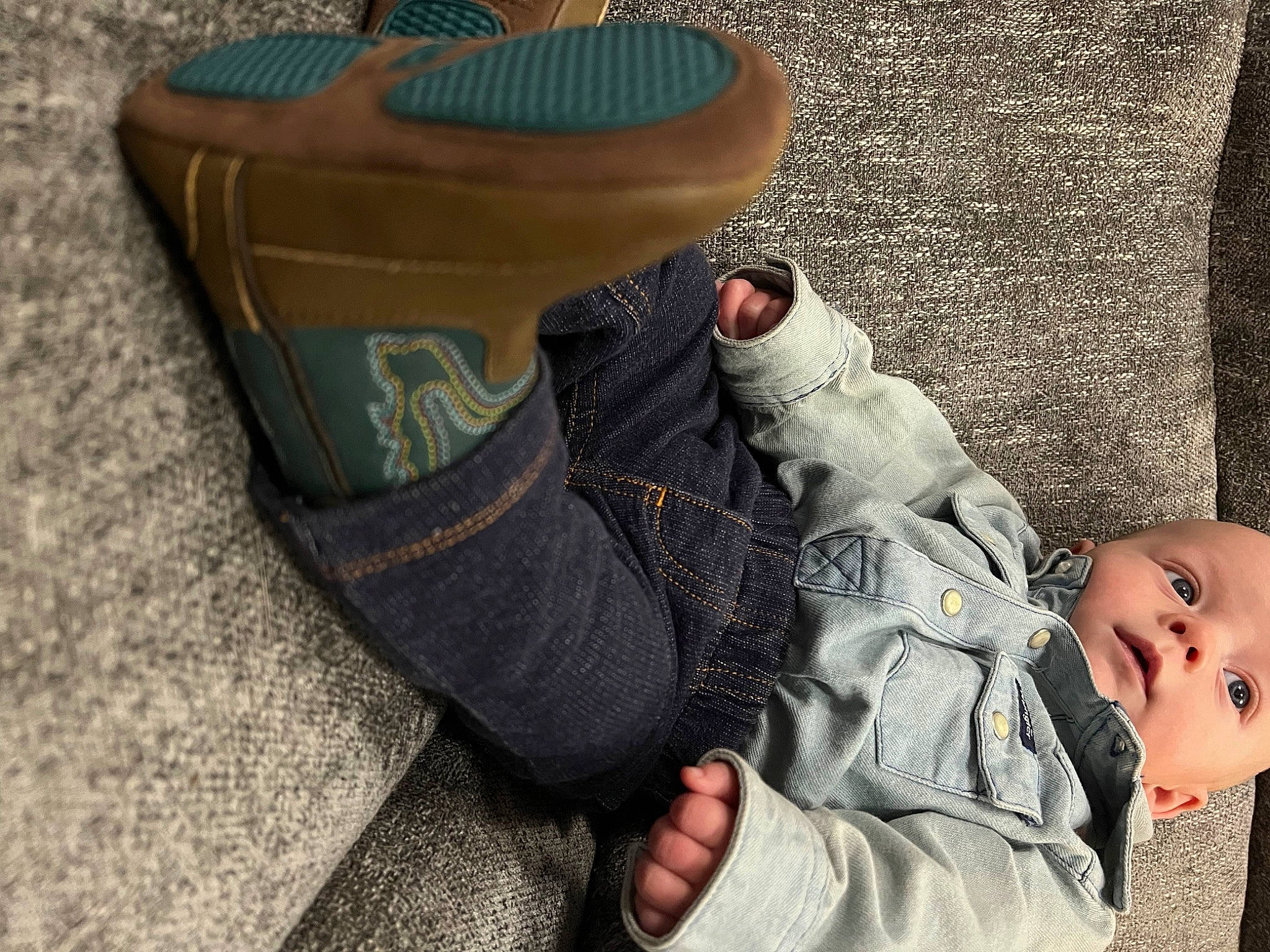 Casey joined the competition — help win amazing prizes! baby, bag, boot, child, comfort, denim, finger, foot, gesture, hand, human_leg, joint, knee, leg, outdoor_shoe, person, sitting, sneakers, thigh, toddler