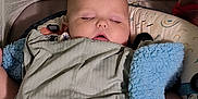 Casey joined the competition — help win amazing prizes! baby, sleeping, blanket, playpen, infant, cozy, peaceful, child, soft_lighting, indoor, resting, cute, pajamas, toddler, comfort, face, hands, head, nap, relaxation