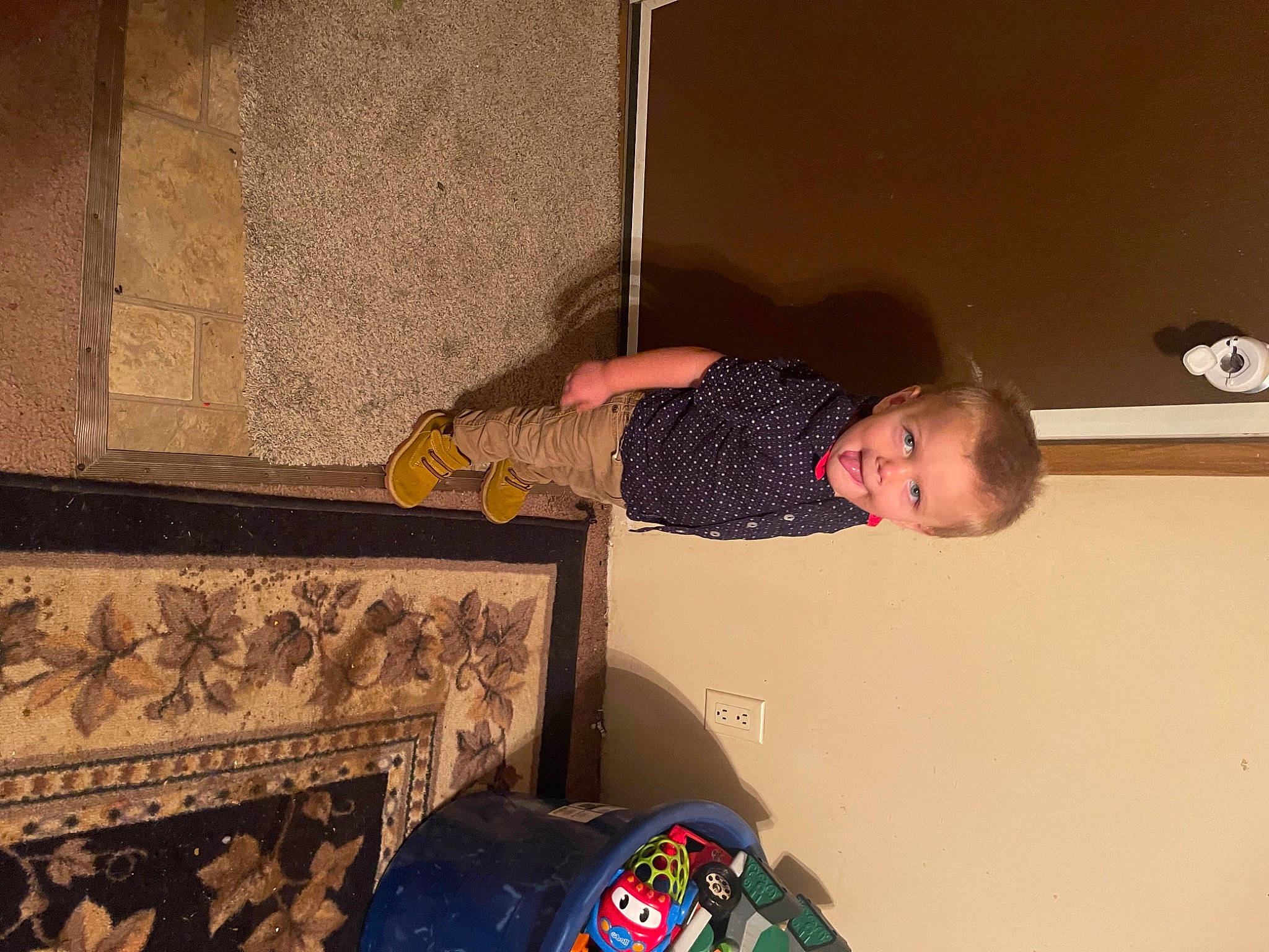 Ayden is registered to the contest to win money with this photo: audio_equipment, automotive_tire, ceiling, child, flooring, fun, person, room, t_shirt, tire, toddler, wood