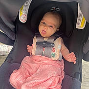 Laila joined the competition — help win amazing prizes! baby, infant, car_seat, blanket, pink_blanket, straps, chicco, face, eyes, mouth, hand, clothing, seat, child, indoor, floor, wood_floor, person, cute, newborn