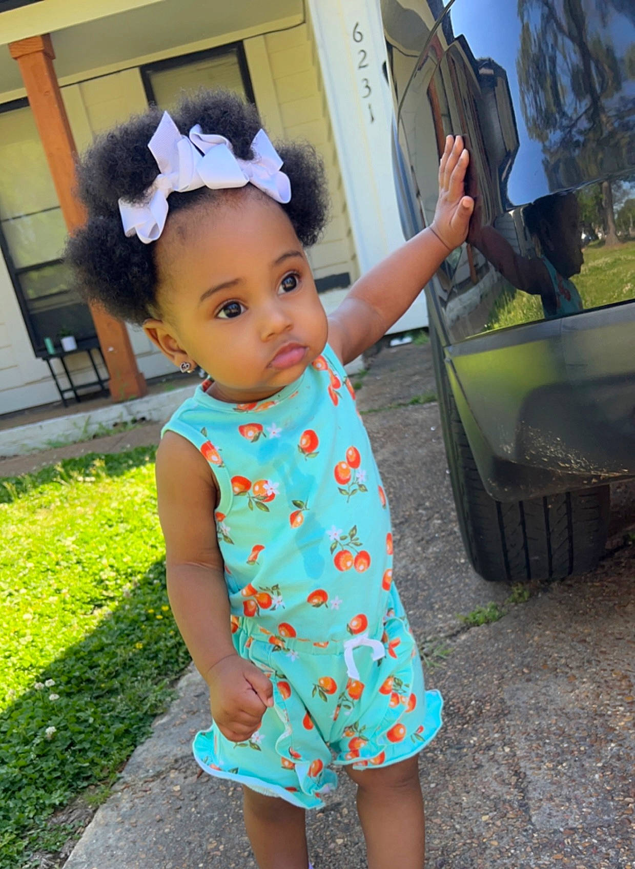 Aveah is registered to the contest to win money with this photo: automotive_exterior, automotive_tire, baby, baby_toddler_clothing, cool, day_dress, fun, grass, happy, leisure, magenta, person, pink, plant, sleeve, t_shirt, tire, toddler, travel, vehicle_door