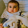 baby, blanket, child, cozy, cushion, cute, expression, face, indoors, infant, pattern, pillow, portrait, seat, soft_texture, star_pattern, striped_clothing, toddler, wide_eyes, young