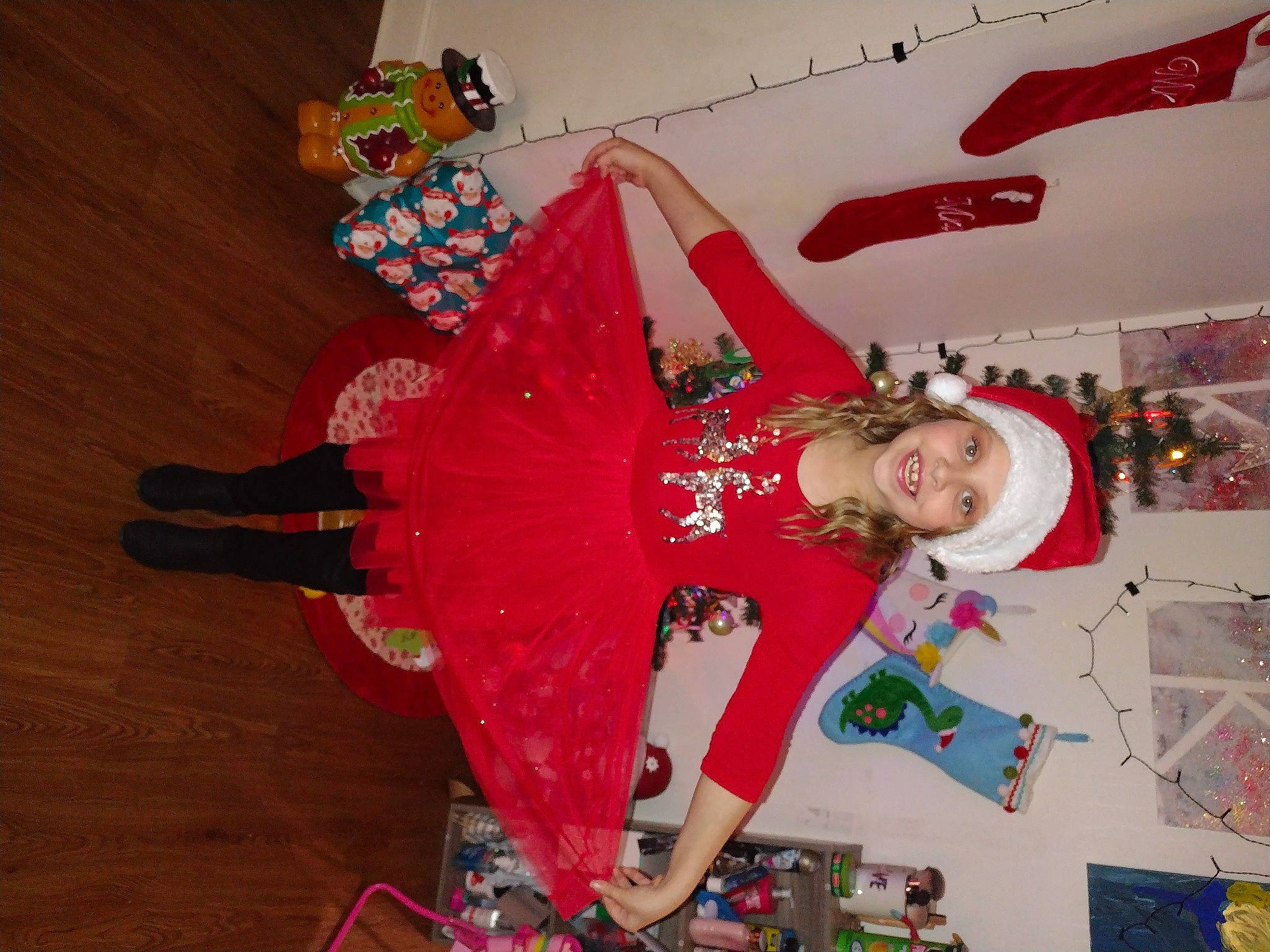 Adelynn is registered to the contest to win money with this photo: carmine, child, dance, entertainment, event, fashion_design, flooring, fun, happy, hardwood, headwear, holiday, joy, pattern, person, room, tradition, visual_arts